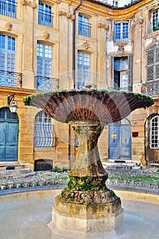 Old fountain in Aix-en-Provence, France photo