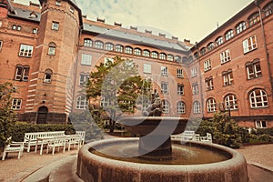 Old fountain in courtyard of Copenhagen City Hall, built in 1905 in Denmark. Architecture in the National Romantic style