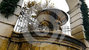 Old fountain in Matera with the water falling down and the drops bounce, historical monument and