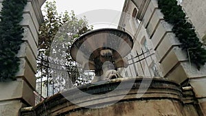 Old fountain in Matera with the water falling down and the drops bounce, historical monument and