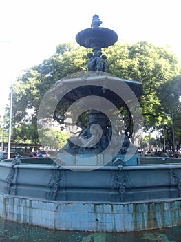 Old fountain in nueve de Julio street photo