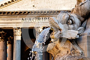 Old fountain and the Pantheon in central Rome