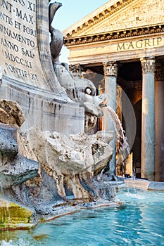 Old fountain and the Pantheon in central Rome