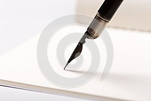 Old fountain pen with clipping path write on white paper background