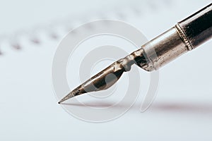 Old fountain pen with clipping path write on white paper background