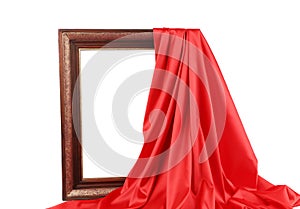 Old frame and red silk drapery.