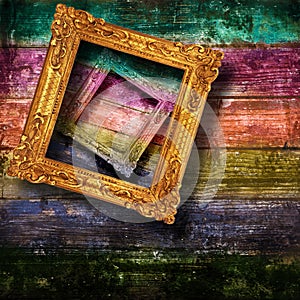Old frames hanging on wood wall