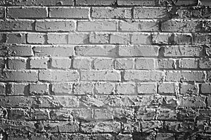old, frayed black and white brick wall texture, background