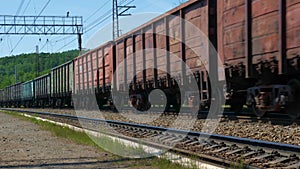 Old freight train rides on railways