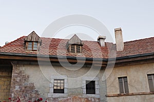 Old french European style traditional stone cottages, villas or houses, classic roof and brick work