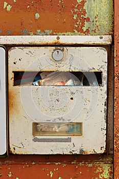 Old letterbox filled with junk mail