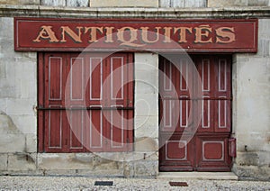 Old French shuttered store front in red