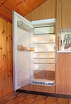 Old fridge in a dated kitchen