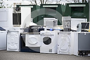 Old fridges freezers wash machines and kitchen appliances at rubbish dump