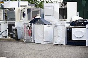 Old fridges freezers wash machines and kitchen appliances at rubbish dump