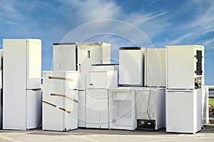 Old fridges freezers wash machines and kitchen appliances at rubbish dump