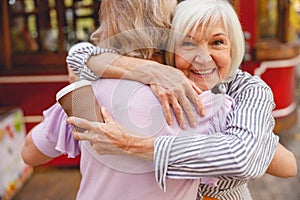 Old friends greeting each other after a long break