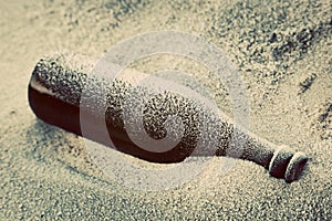 Old frozen bottle lost on the beach.