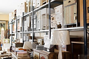 Old furniture offered for sale in secondhand shop photo