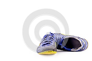 Old futsal shoes on white background football sportware object isolated