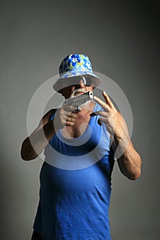 Old gangster with gun