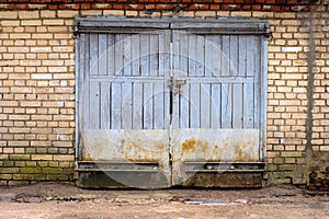 Old garage gate in the brick wall