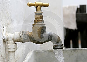 Old garden tap with plastic hose connection