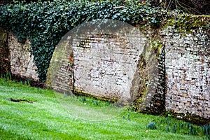 Old garden wall with brick butresses