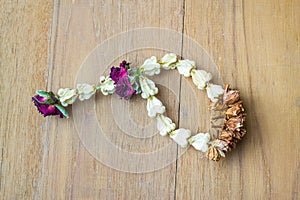 Old garland jasmine on wooden board