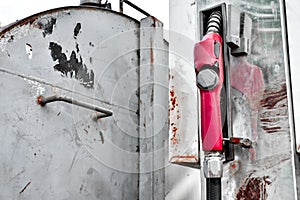 Old gas pump metal rusty station in yard