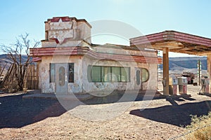 Old gas station in Sahara desert  near Ouarzazate, Morocco. Toned image