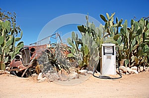 Old gas station with wreck of car