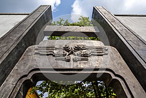 Old gate with Communist star at the entrance of a university in Hanoi, Vietnam