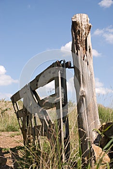 Old gate on knotty post