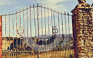 Old gate and Ronda town in distance, Spain