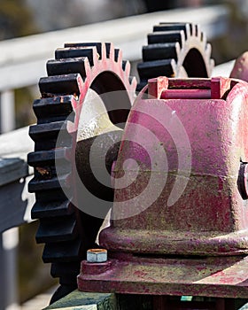 Old gears and cogs against blurred background