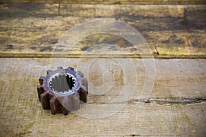 Old gears of the machine on wooden background