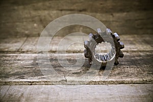 Old gears of the machine on wooden background. The gears on vintage picture style