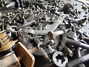 Old gears and old nut on wooden tables