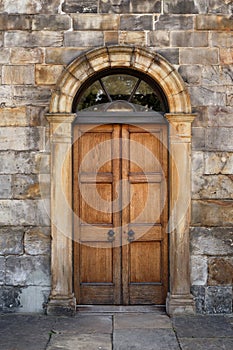 Old Georgian stone townhouse door with fanlight window above door