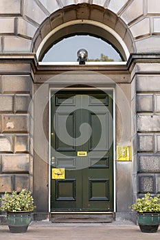 Old Georgian stone townhouse door with fanlight window above door