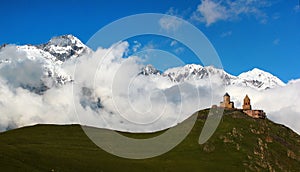 Old Gergeti christian church near Kazbegi, Stepantsminda village photo