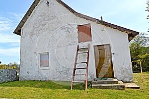 An old German-built house with a staircase on the facade. Lesnoy settlement, Kaliningrad region