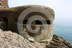 Old german bunker from the second world war on a cliff overlooking the sea at cinque terre in monterosso in liguria