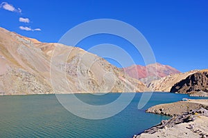 Old german campervan at the Laguna Agua Negra lake to the Paso Agua De Negra, Elqui valley near Vicuna, Chile