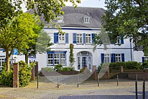 Old German house with wooden door and windows with wooden shutters