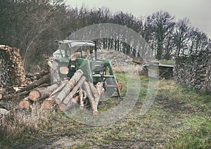 Old German tractor at the lumberyard in nature