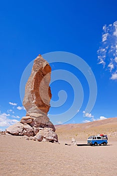 Old german vintage campervan at stone formation Pacana Monks, Monjes De La Pacana, The Indian Stone, near Salar De Tara photo