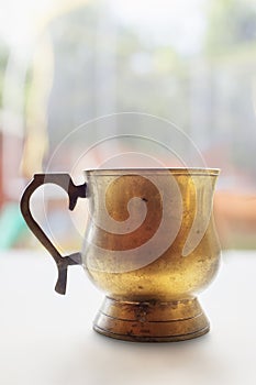 Old gilded copper pitcher