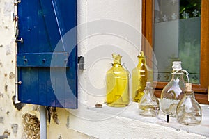 Old glass bottles in window